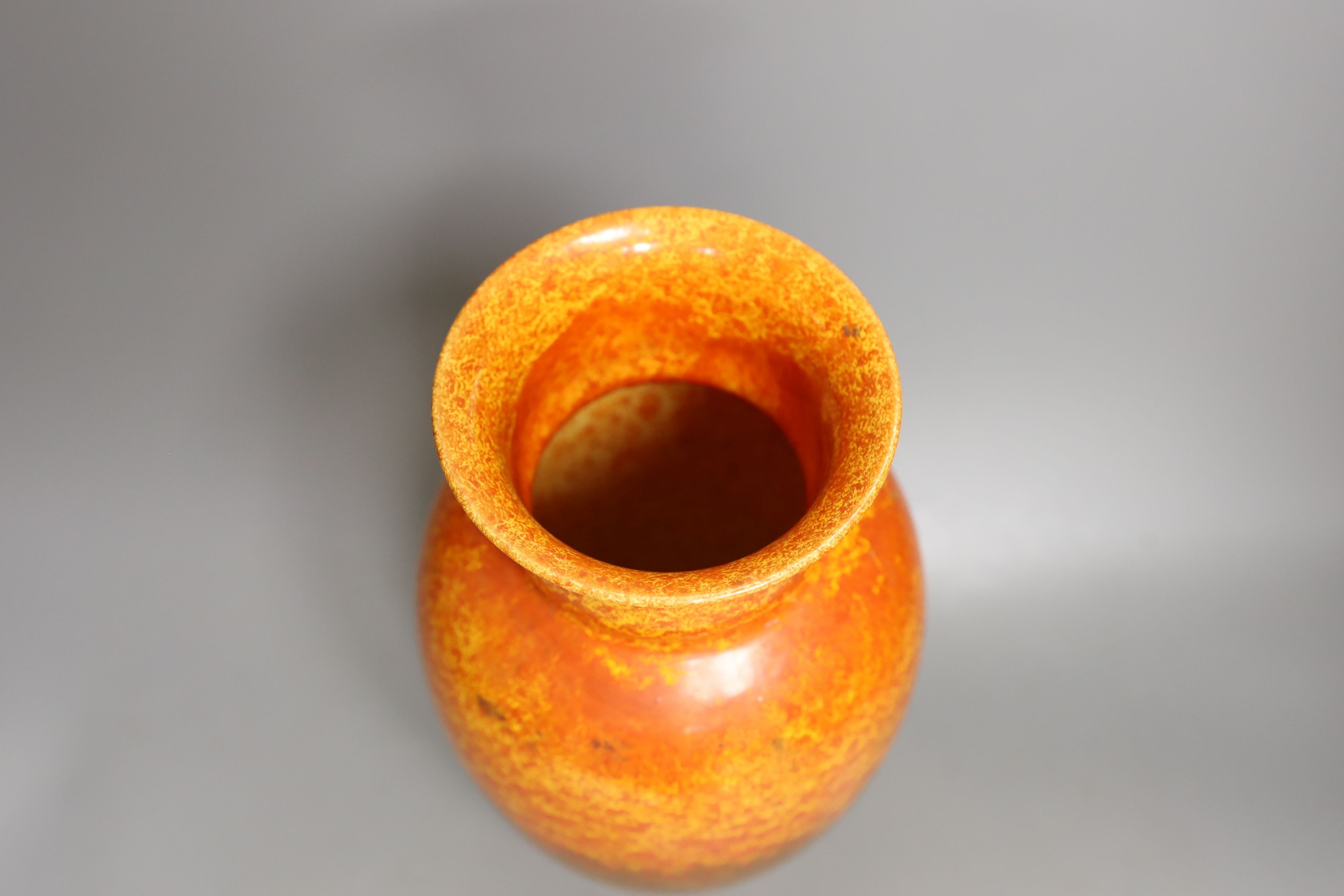 A Pilkington's Royal Lancastrian orange mottle glazed vase, 29 cms high.